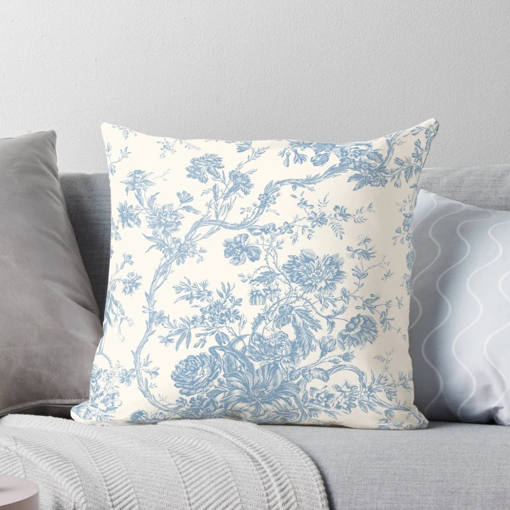 Decorative floral pillow with French Toile de Jouy inspired pattern in soothing blue hues