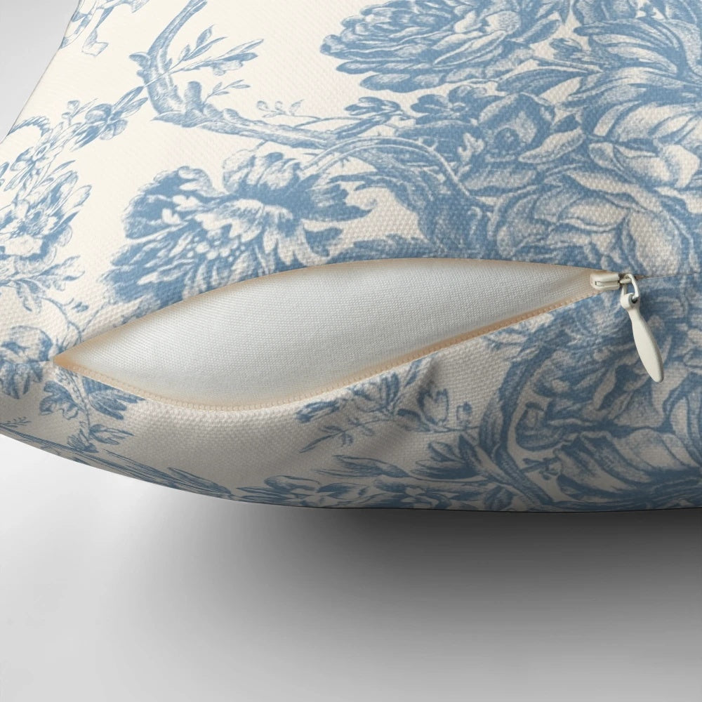 Decorative floral pillow with French Toile de Jouy inspired pattern in soothing blue hues