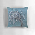 Vintage-style floral bouquet pillow in blue, white, and grey