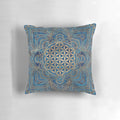 Decorative blue marble and gold pillow with a Flower of Life mandala design