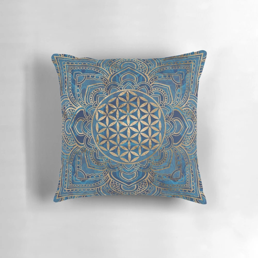 Decorative blue marble and gold pillow with a Flower of Life mandala design
