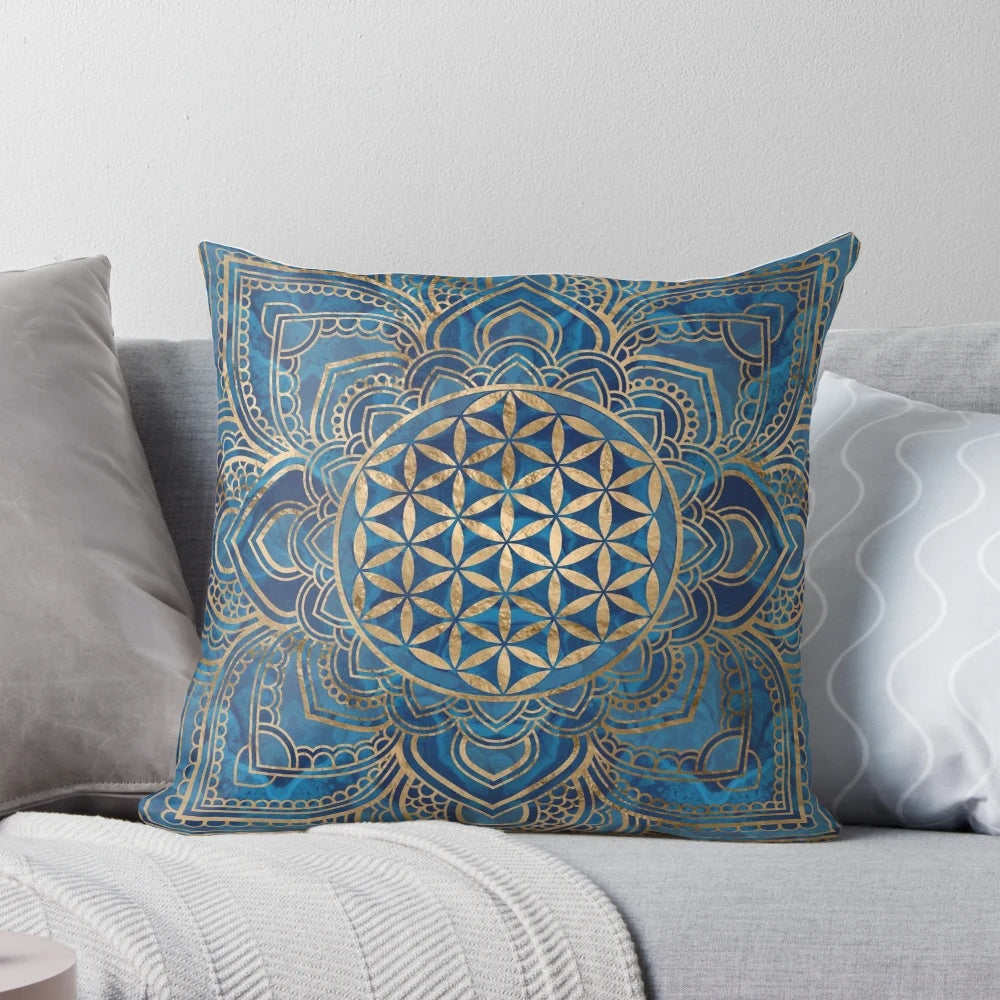 Decorative blue marble and gold pillow with a Flower of Life mandala design