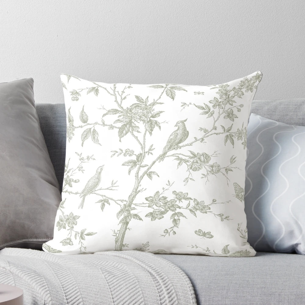 Decorative throw pillow with a vintage French toile pattern in a beautiful sage green color