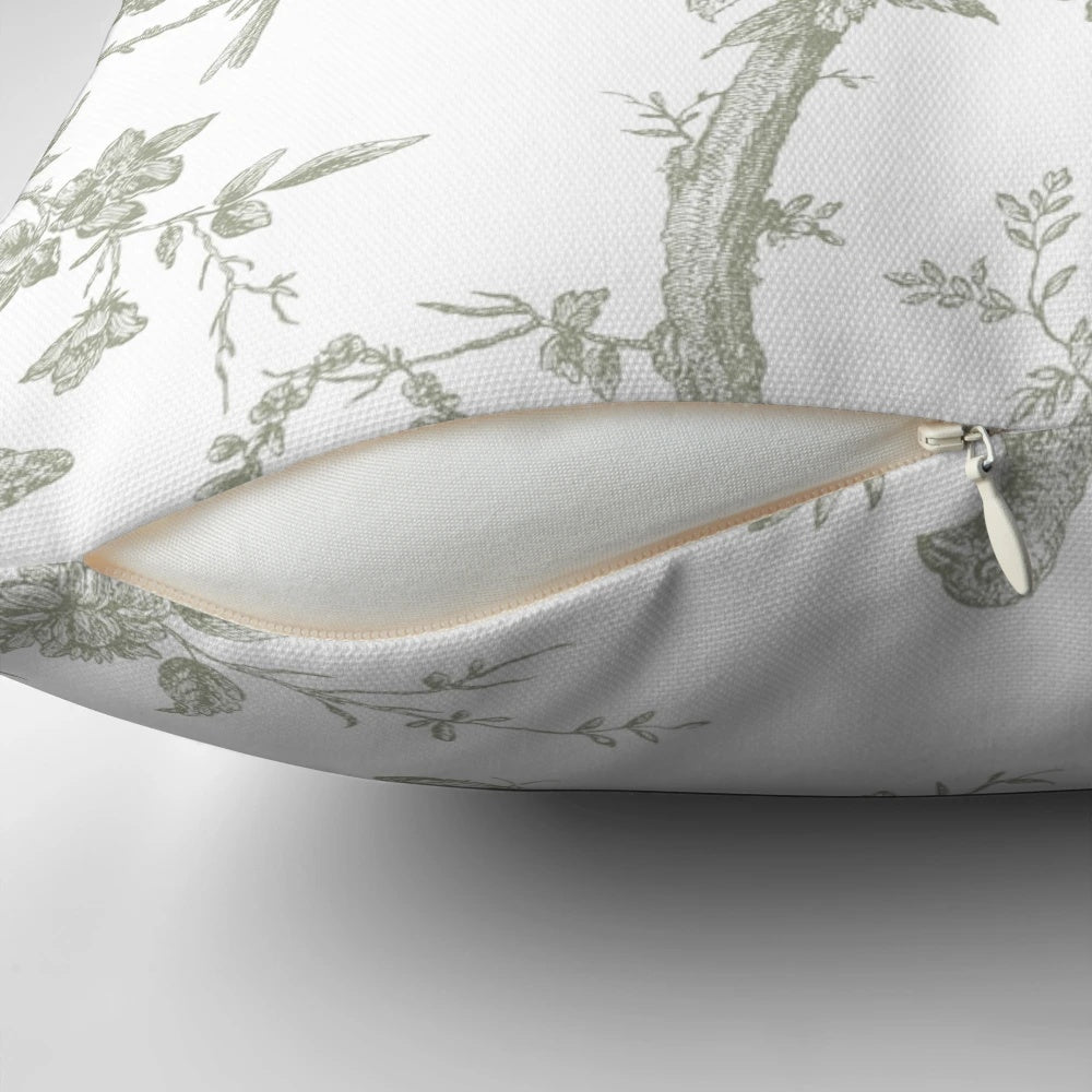 Decorative throw pillow with a vintage French toile pattern in a beautiful sage green color