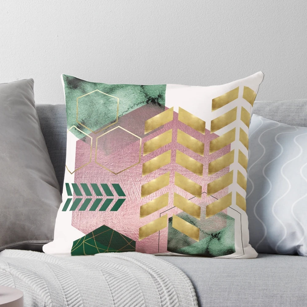 Elegant geometric pattern pillow in blush pink and emerald green shades