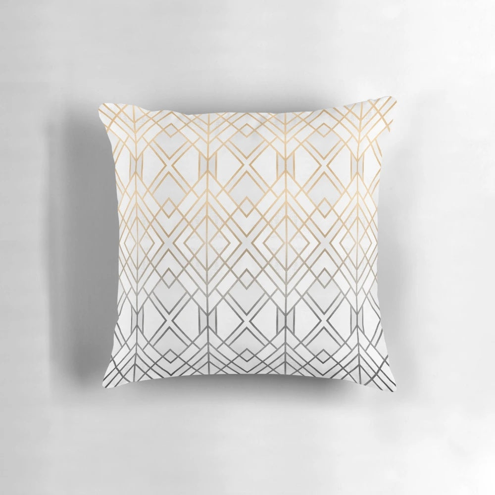 Decorative gold and grey patterned pillow with abstract geometric design