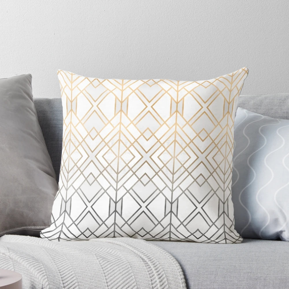Decorative gold and grey patterned pillow with abstract geometric design