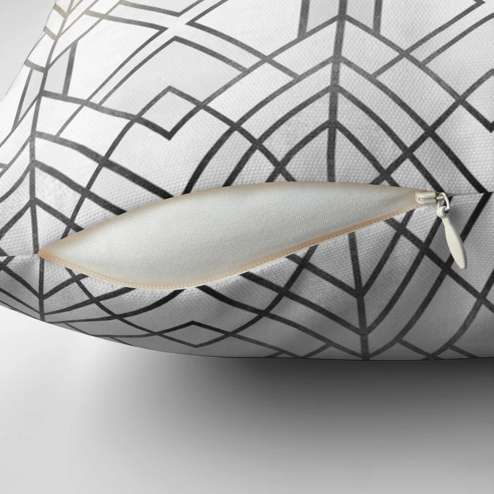 Decorative gold and grey patterned pillow with abstract geometric design