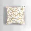 Gold foil geometric mosaic pattern on a decorative throw pillow