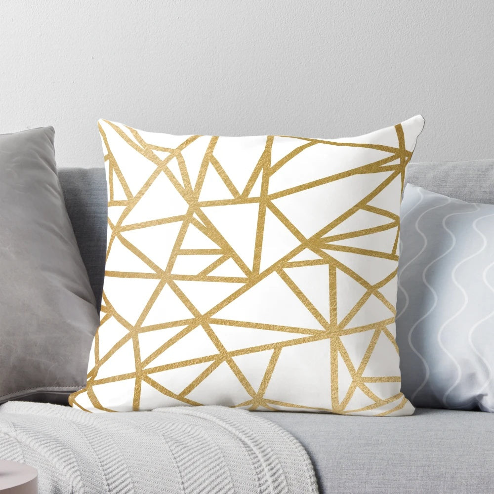 Gold foil geometric mosaic pattern on a decorative throw pillow
