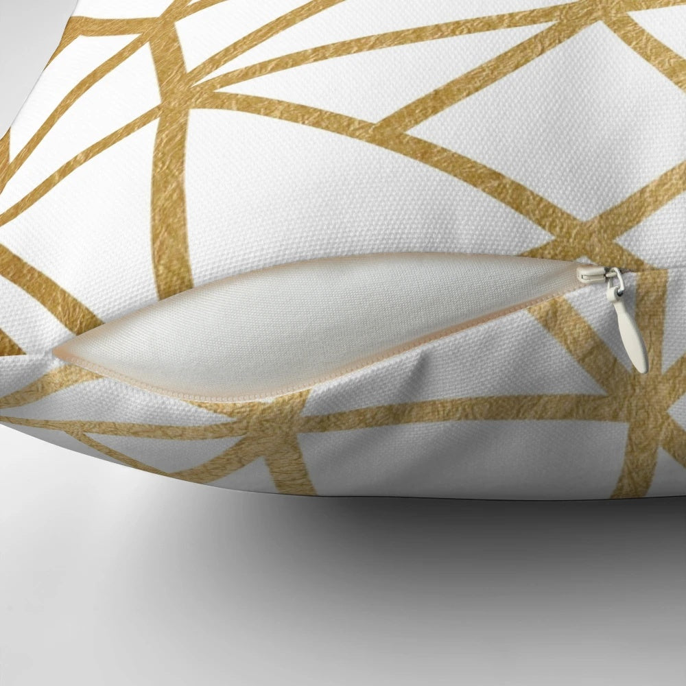 Gold foil geometric mosaic pattern on a decorative throw pillow