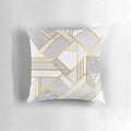 A luxurious modern gold and white geometric pillow with an abstract mosaic design