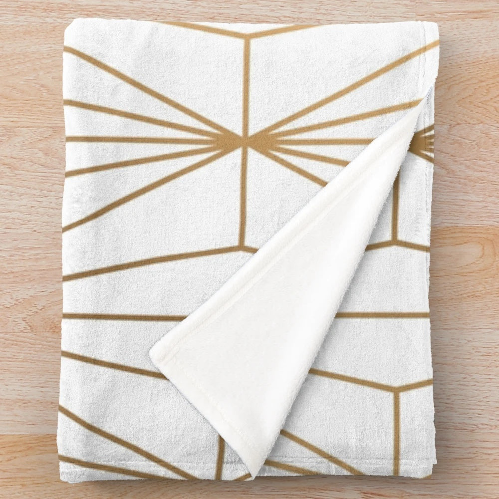 Gold geometric pattern illustration on a plush, shimmering blanket