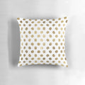 Decorative throw pillow with a modern gold leaf polka dot and brushstroke pattern