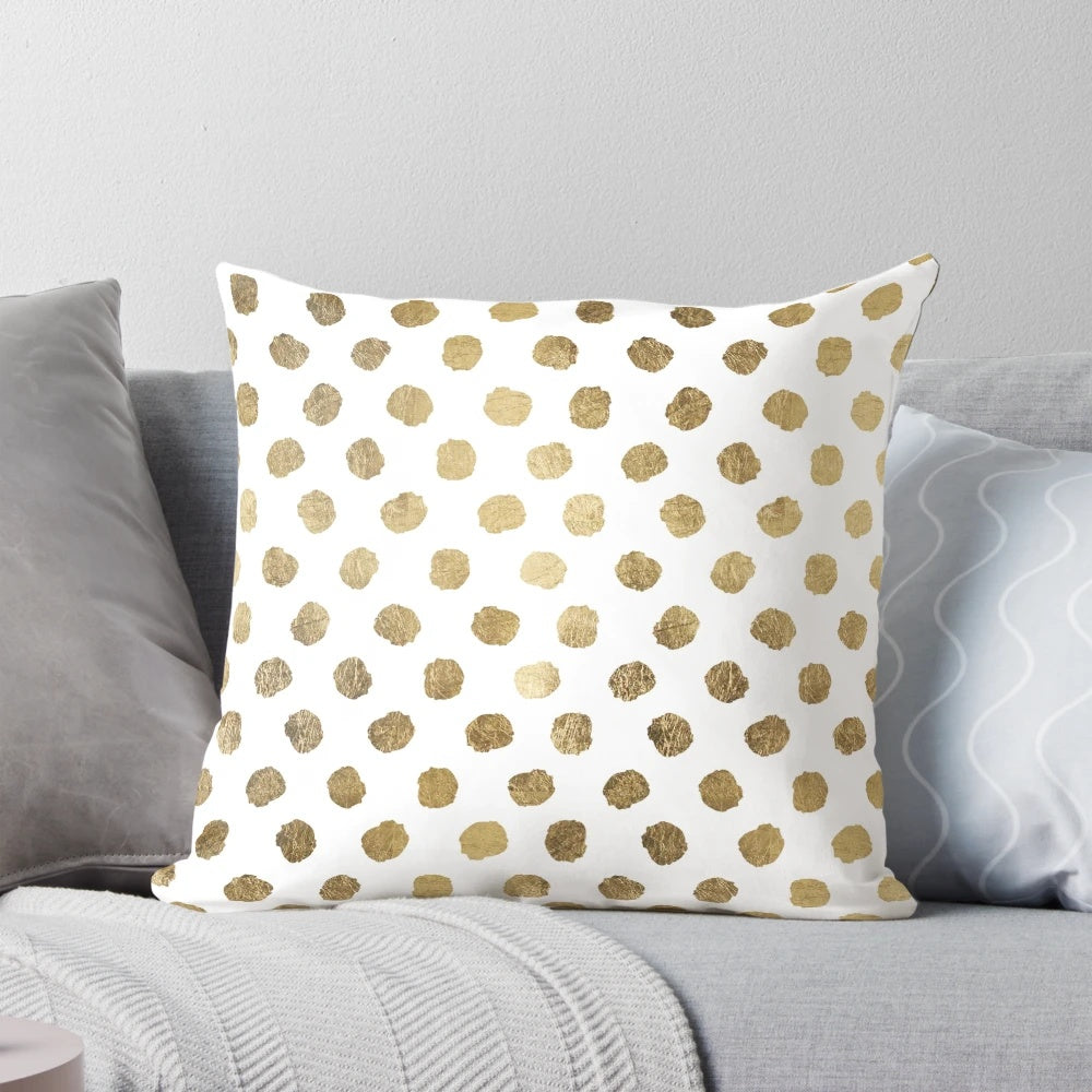Decorative throw pillow with a modern gold leaf polka dot and brushstroke pattern