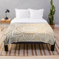 Gold mandala pattern plush blanket with shimmery abstract design