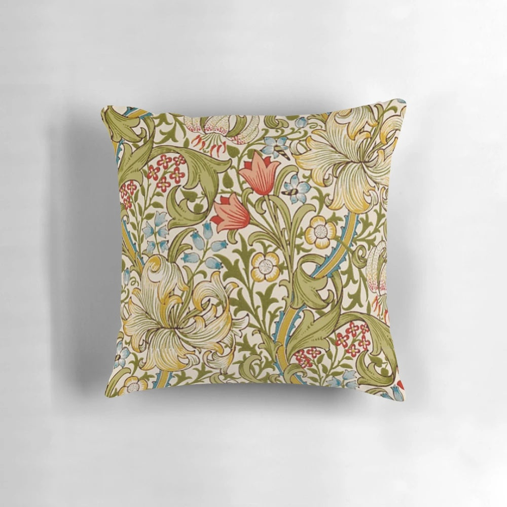 A decorative pillow featuring a golden lily flower pattern, inspired by the designs of the English Arts and Crafts movement.