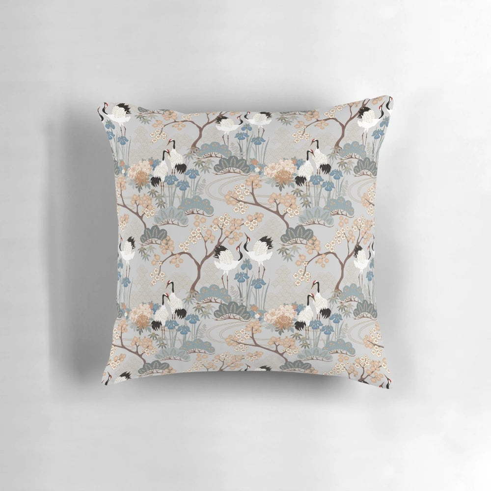 Gray floral pillow with red capped cranes in an Asian-inspired design