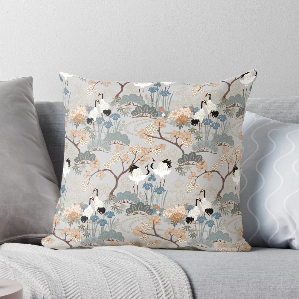 Gray floral pillow with red capped cranes in an Asian-inspired design