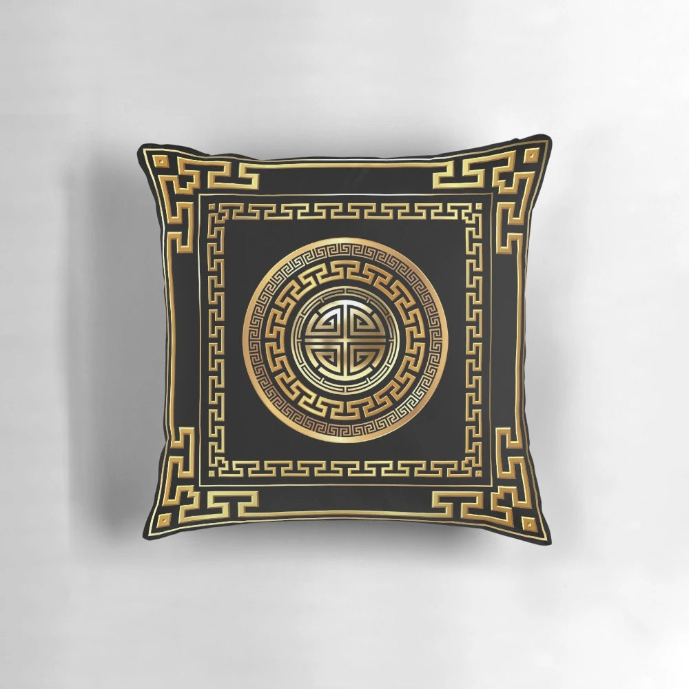 Black and gold decorative pillow with a Greek key meander pattern design