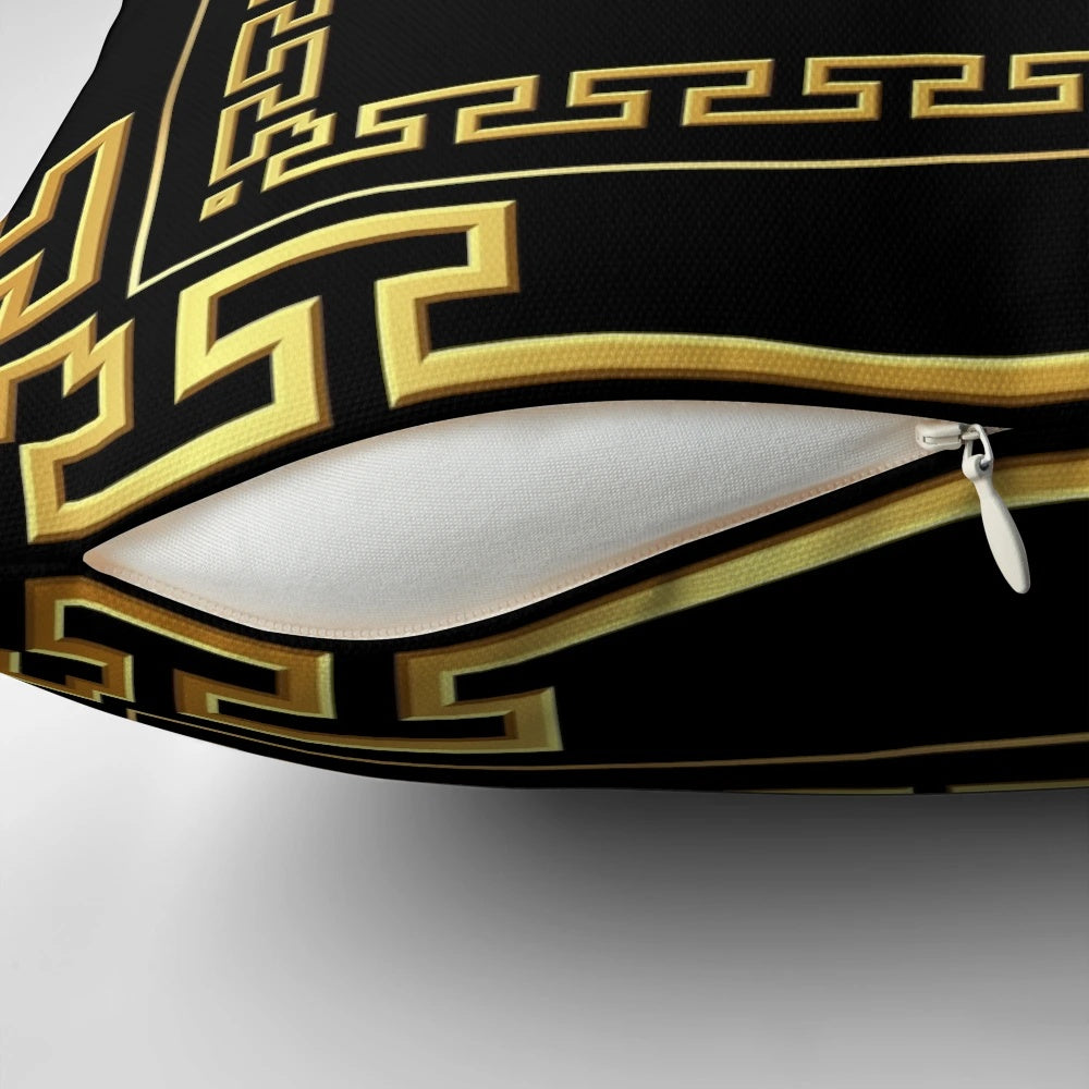 Black and gold decorative pillow with a Greek key meander pattern design