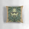 An ornate, fantasy-inspired pillow featuring the Green Man, a pagan nature deity surrounded by lush foliage and scrollwork.