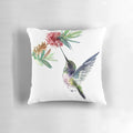 Vibrant hummingbird and flower design on a soft, decorative pillow