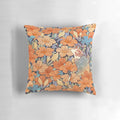 Decorative pillow featuring a beautifully illustrated Japanese cat surrounded by vibrant orange flowers and botanical elements.