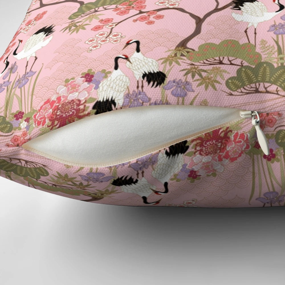 Vibrant pink and white floral pillow with Japanese garden and crane motifs.
