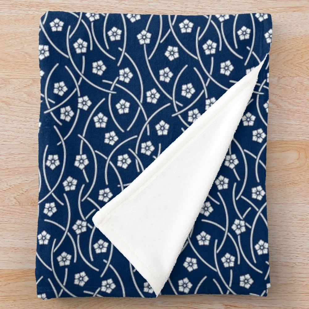 Soft and cozy Japanese-inspired plush blanket featuring beautiful cherry blossom design