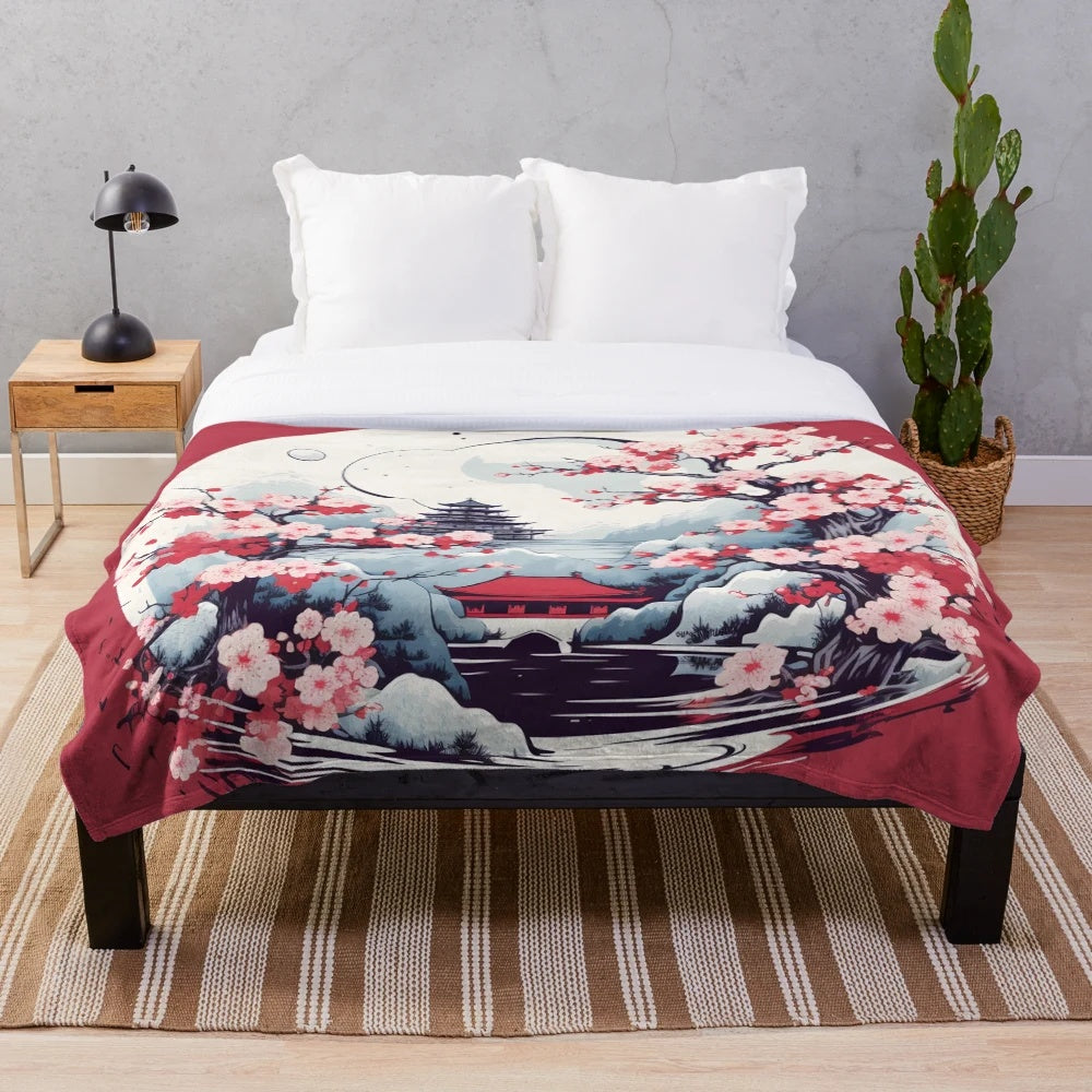 Cozy plush blanket featuring a Japanese-inspired design with a tower silhouette and cherry blossoms