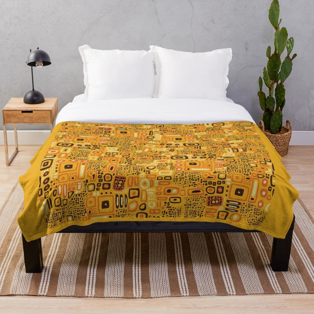 Klimt-inspired plush blanket with intricate golden pattern