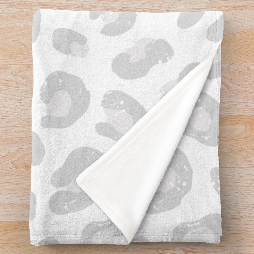 Soft and cozy leopard print plush blanket in silver gray and white colors