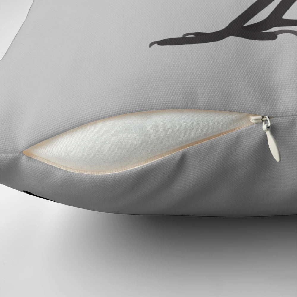 Magpie decorative pillow with black and white feathers in a profile side view