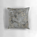 Marbled pattern throw pillow in gold, black, and grey colors