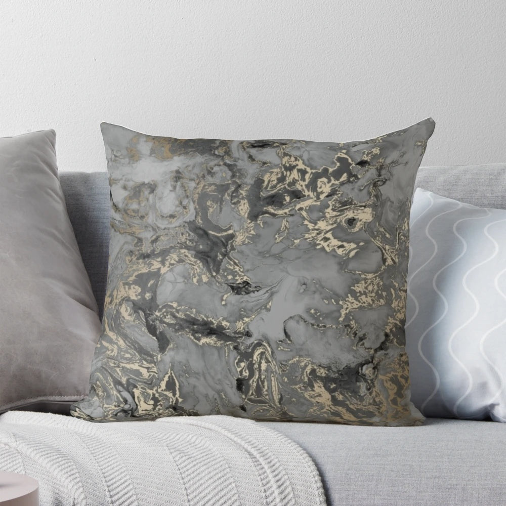 Marbled pattern throw pillow in gold, black, and grey colors