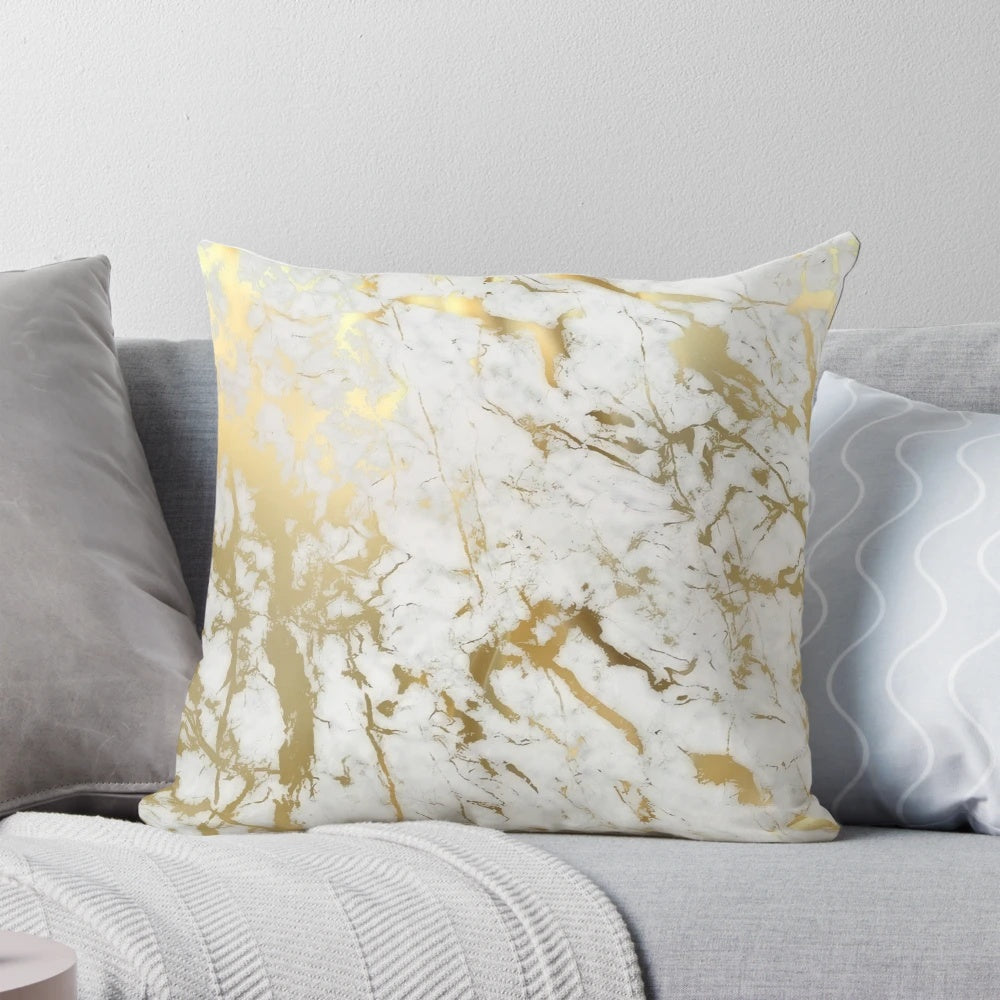 Decorative pillow featuring a minimalist, natural marble pattern with subtle gold accents.