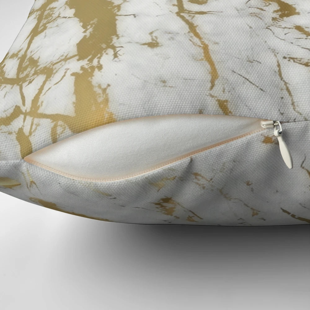 Decorative pillow featuring a minimalist, natural marble pattern with subtle gold accents.
