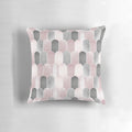 A minimalist mid century-inspired pillow featuring a pattern of overlapping arches in blush pink and grey.