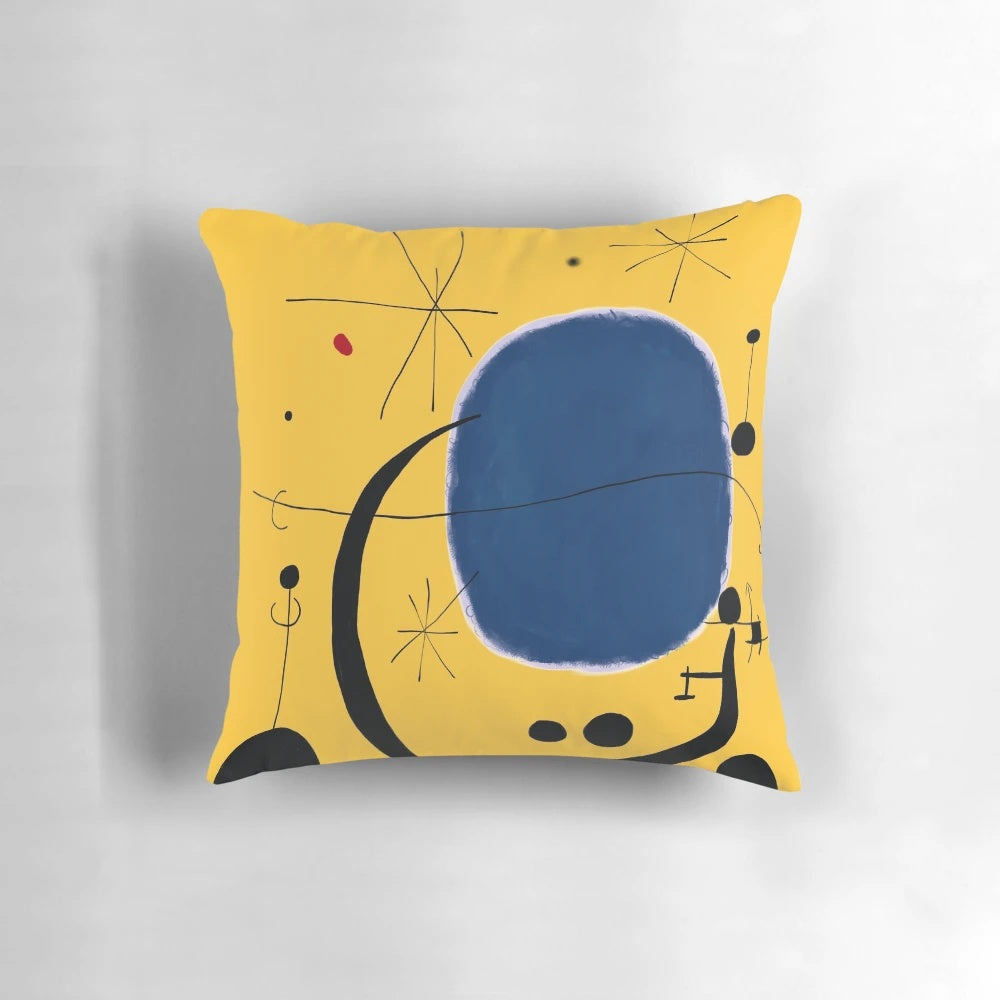 Striking pillow featuring a minimalist abstract design in bold blue and yellow tones, inspired by the iconic artwork of Joan Miró.
