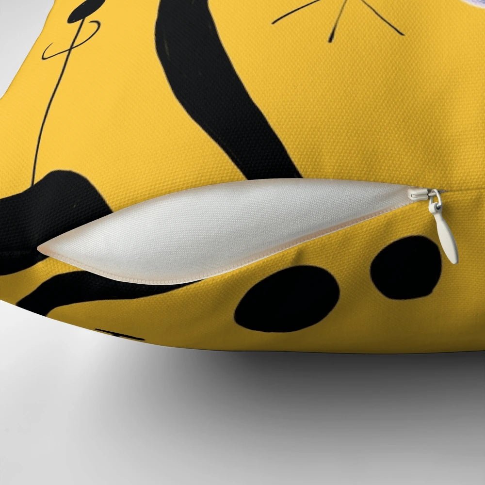 Striking pillow featuring a minimalist abstract design in bold blue and yellow tones, inspired by the iconic artwork of Joan Miró.