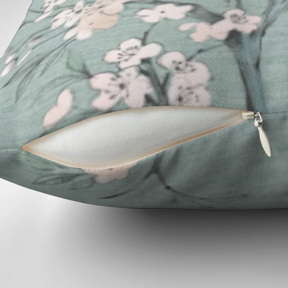 A modern, nature-inspired pillow with a minimalist, geometric design in duck egg blue and cream colors.