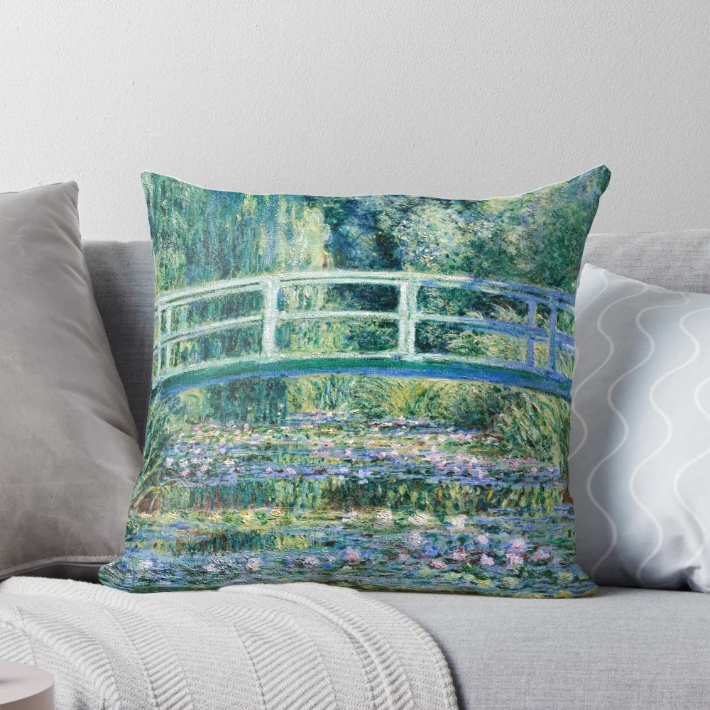A vibrant throw pillow featuring Claude Monet's famous water lilies and Japanese bridge painting.