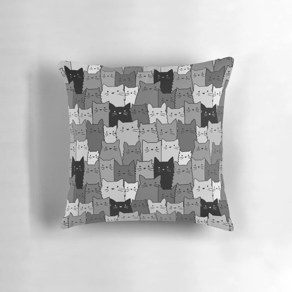 A black and white monochromatic pillow featuring a cute and kawaii silent cat or kitten pattern, perfect for pet owners and cat lovers.