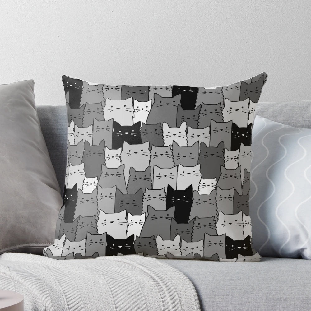 A black and white monochromatic pillow featuring a cute and kawaii silent cat or kitten pattern, perfect for pet owners and cat lovers.
