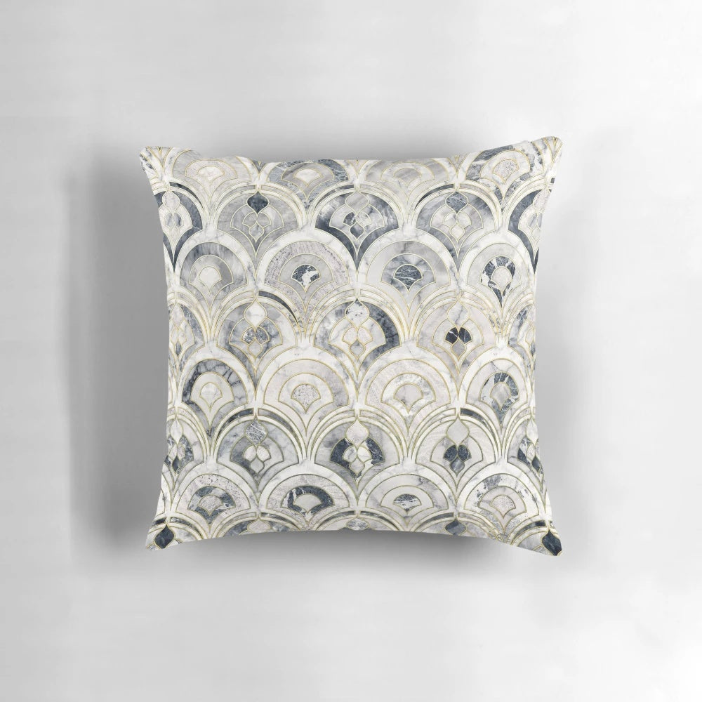 A stylish monochrome marble tile-inspired pillow with an art deco pattern.