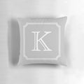 Silver gray monogram K pillow with a minimalist, elegant design