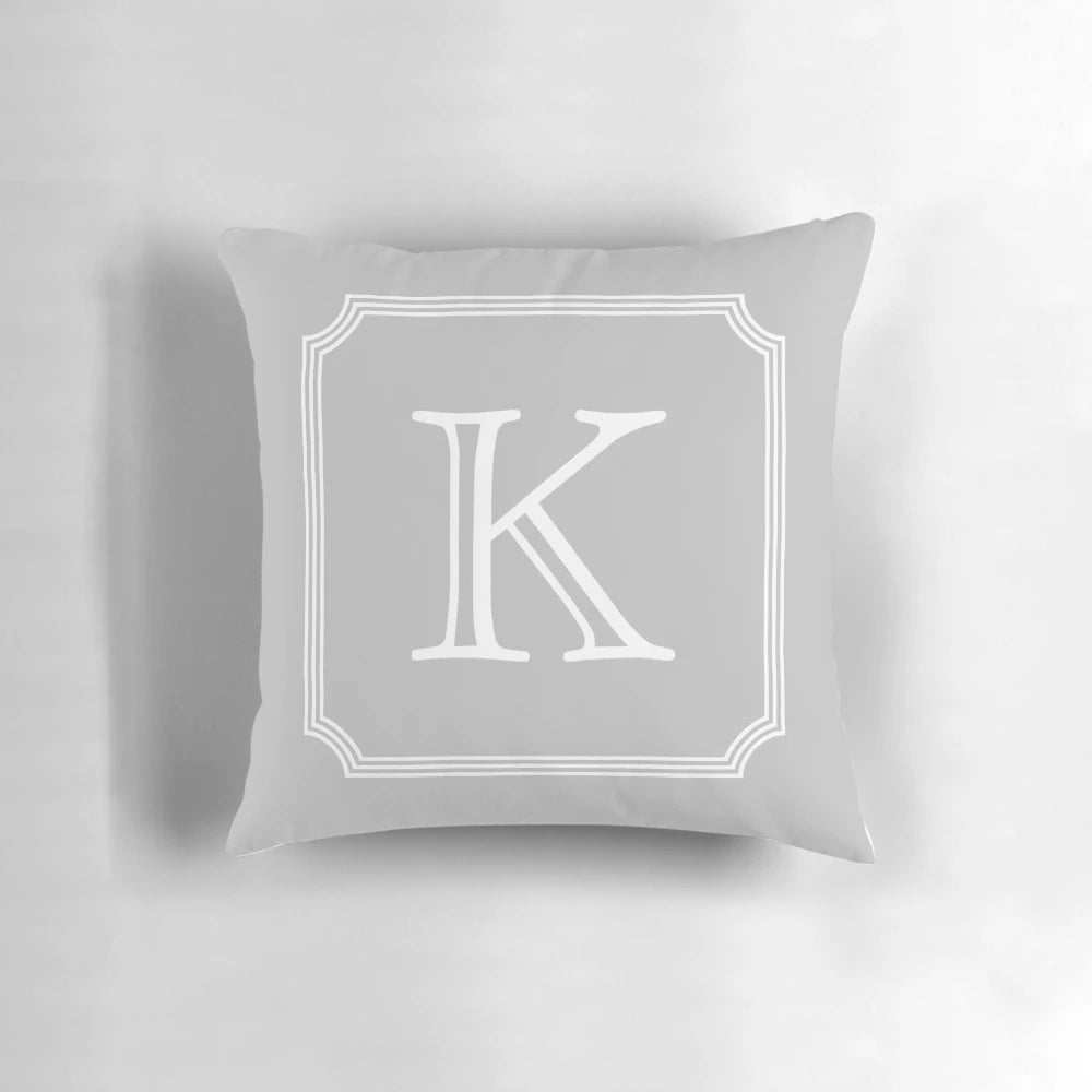 Silver gray monogram K pillow with a minimalist, elegant design
