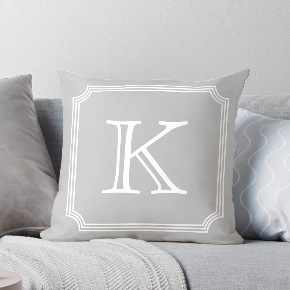 Silver gray monogram K pillow with a minimalist, elegant design