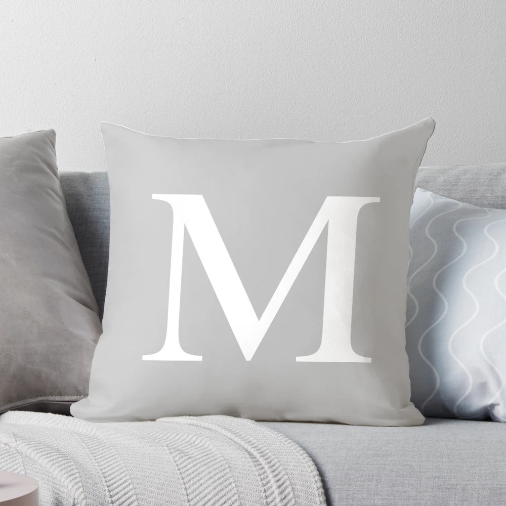 Silver gray monogram M pillow with a minimalist, classy design